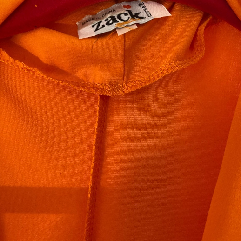 Wrap dress, high slit, mini shoulder pads for a soft structured look. Sexy